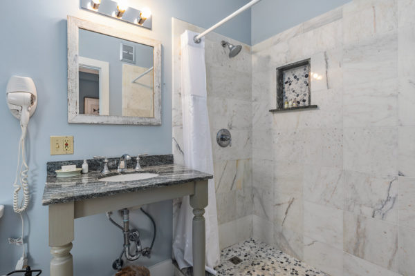 guestroom bathroom with tiled shower