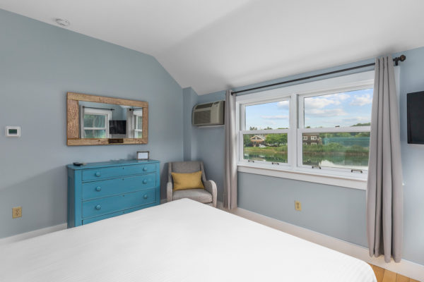 guestroom with window overlooking water
