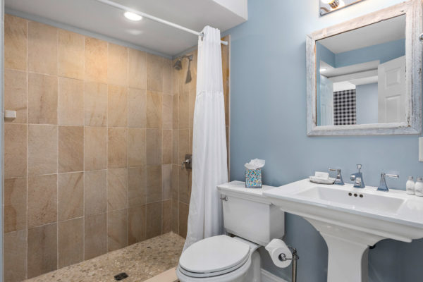 bathroom with tiled shower